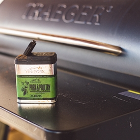 Cooking outdoors with a Traeger grill.