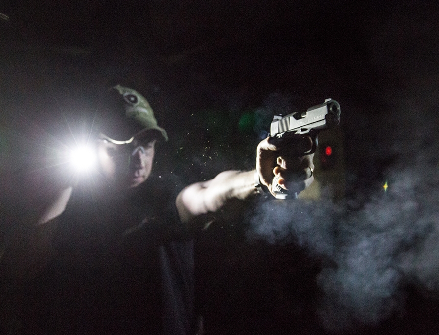 Defender Outdoors shooting handguns.