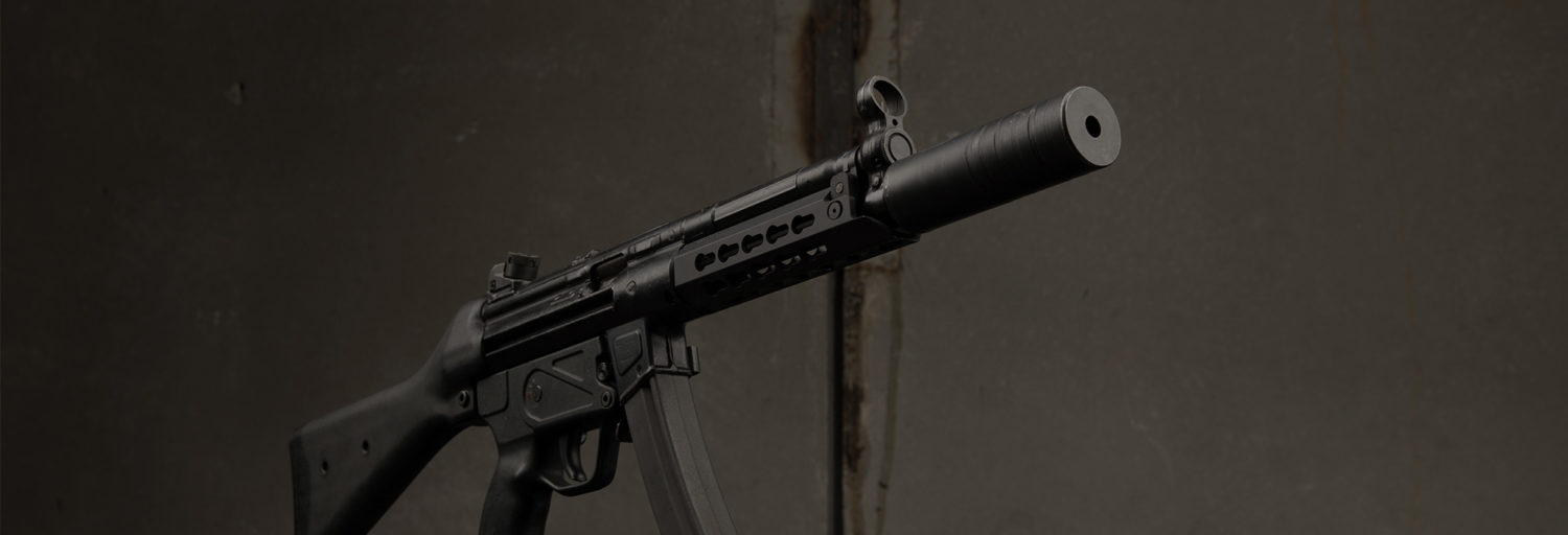 The MP5 and a SilencerCo Omega 9K.