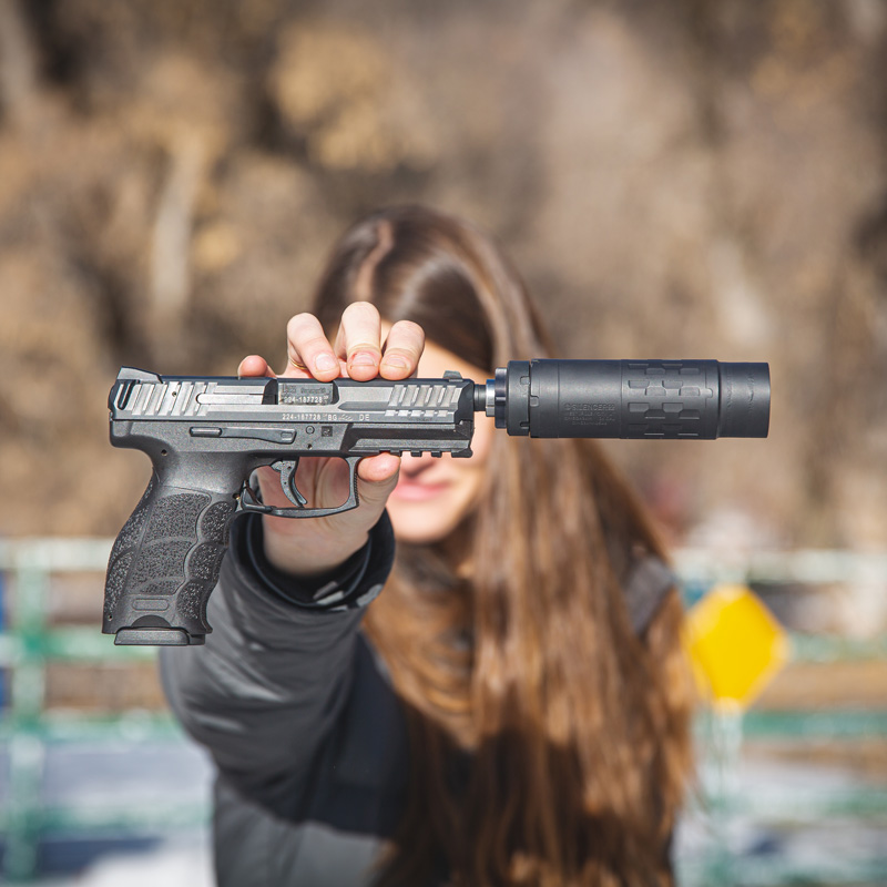 Woman holding an Omega 36M Short configuration on an HK VP9