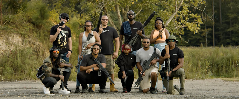 American Gun owners, who are immigrants, posing with their firearms, many of which are suppressed with SilerncerCo suppressors.