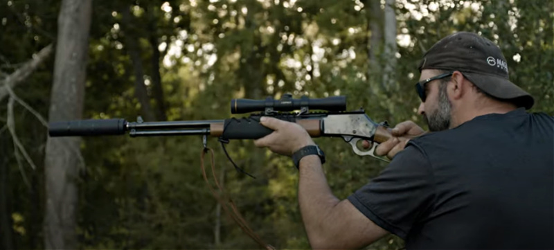 American Gun - The farmer aiming a long gun with suppressor