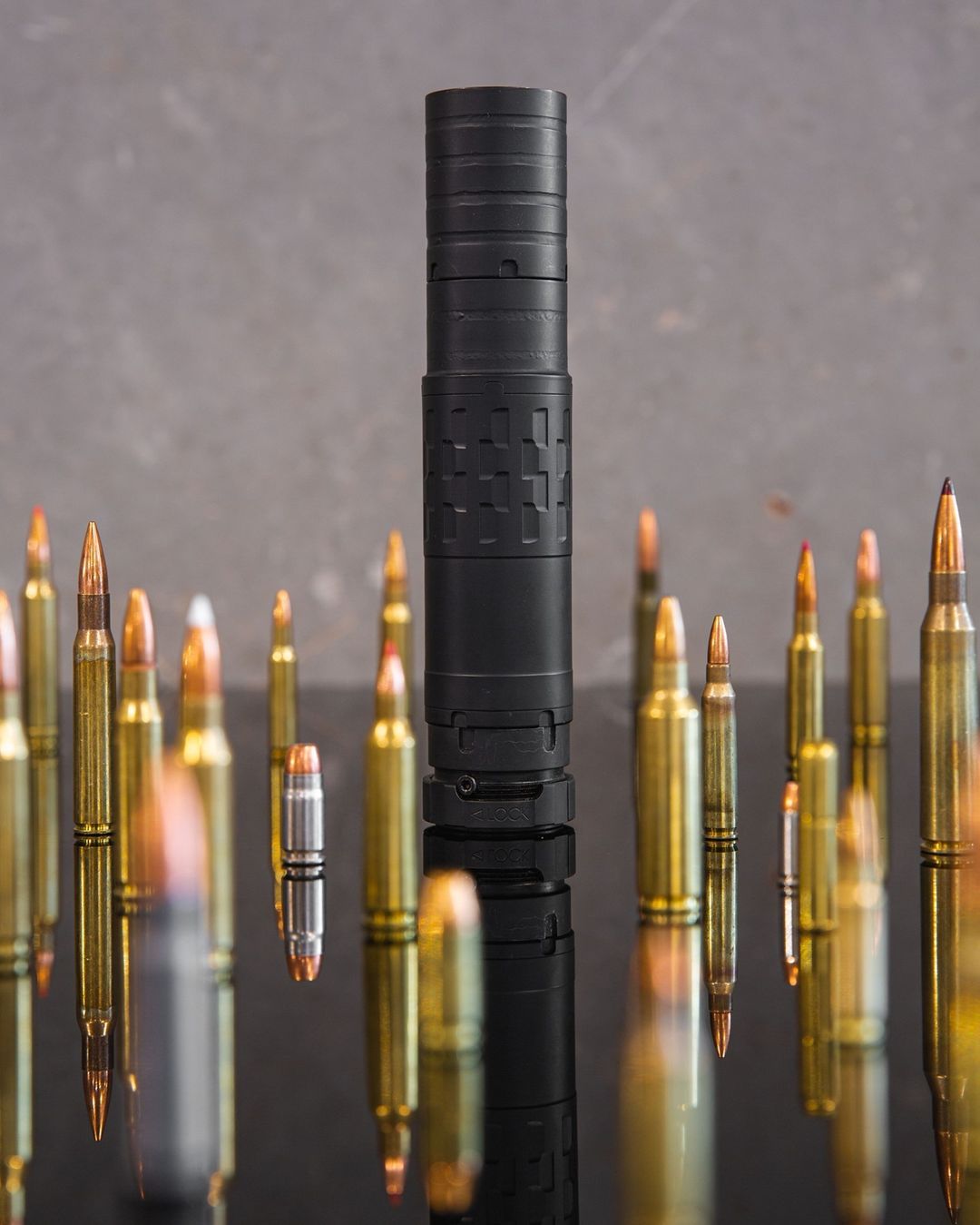 SilencerCo Omega 36M multi-caliber suppressor with various cartridges