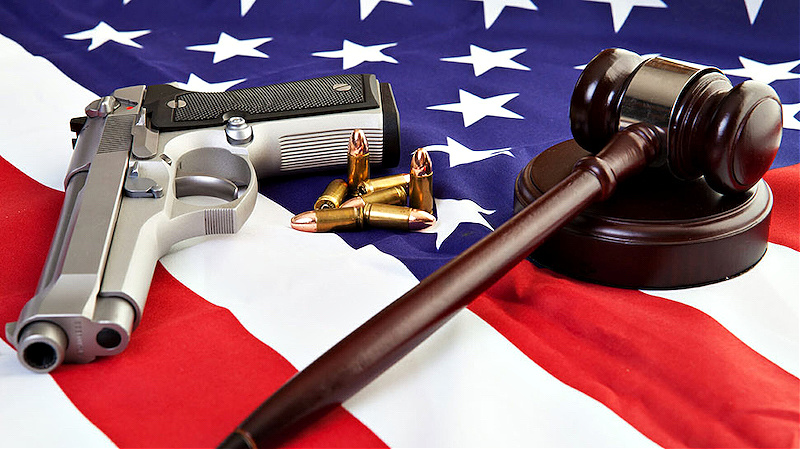American flag with firearm and gavel