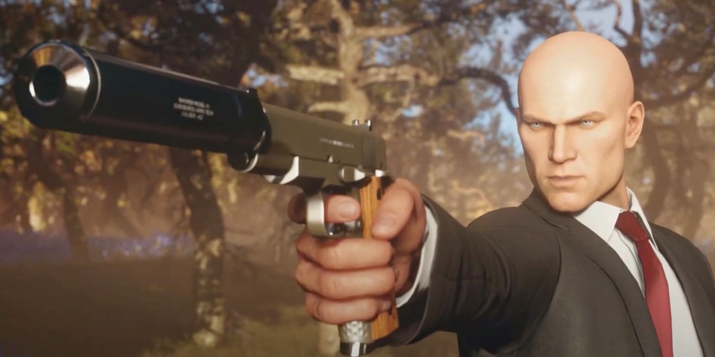 Agent 47 in video game with suppressed handgun