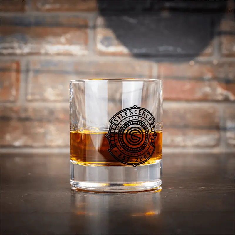 SilencerCo whiskey glass on a brick background