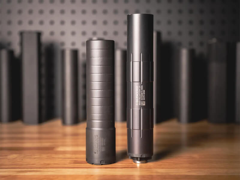 rifle and pistol suppressors, side by side