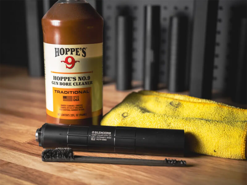 suppressor with cleaning supplies