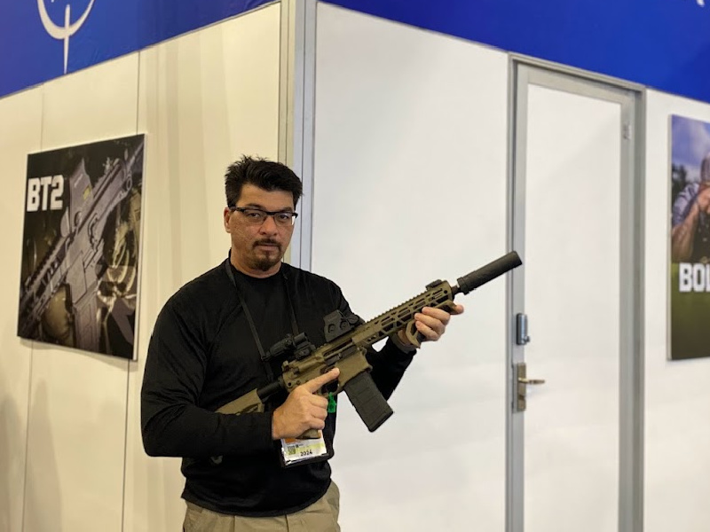 Rock River Arms at SHOT Show 2024 with LAR-BT2 suppressed with SilencerCo Saker 556K.
