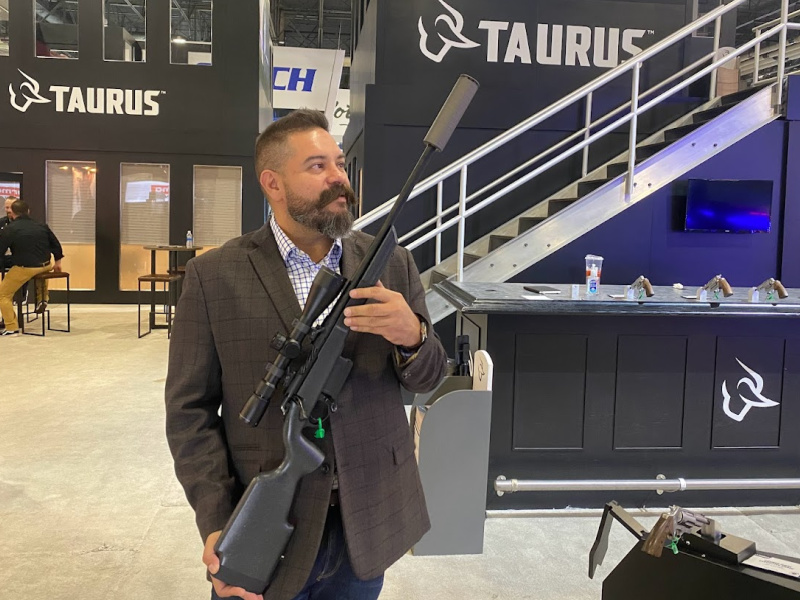 Taurus at SHOT Show 2024 with Expedition 308 bolt action rifle suppressed with a SilencerCo Scythe-Ti.