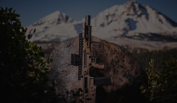 short-barrel CZ Bren 2 Ms chambered in .300 Blackout with SilencerCo Omega 300 and low-profile front cap