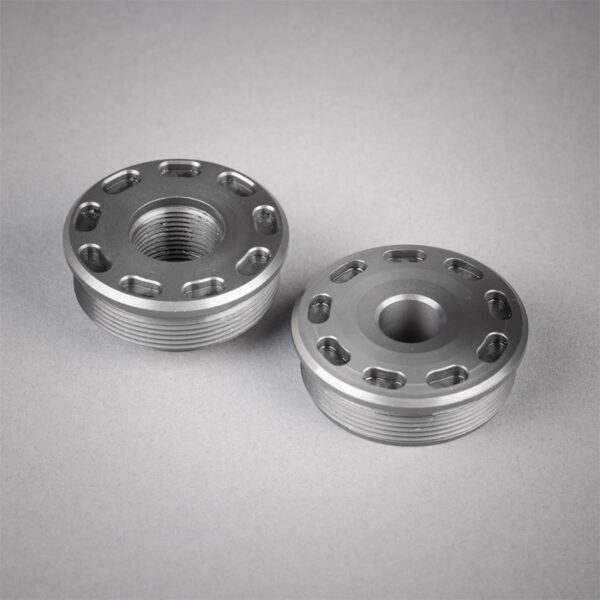 bravo titanium front cap and bravo titanium direct thread mount on a grey background