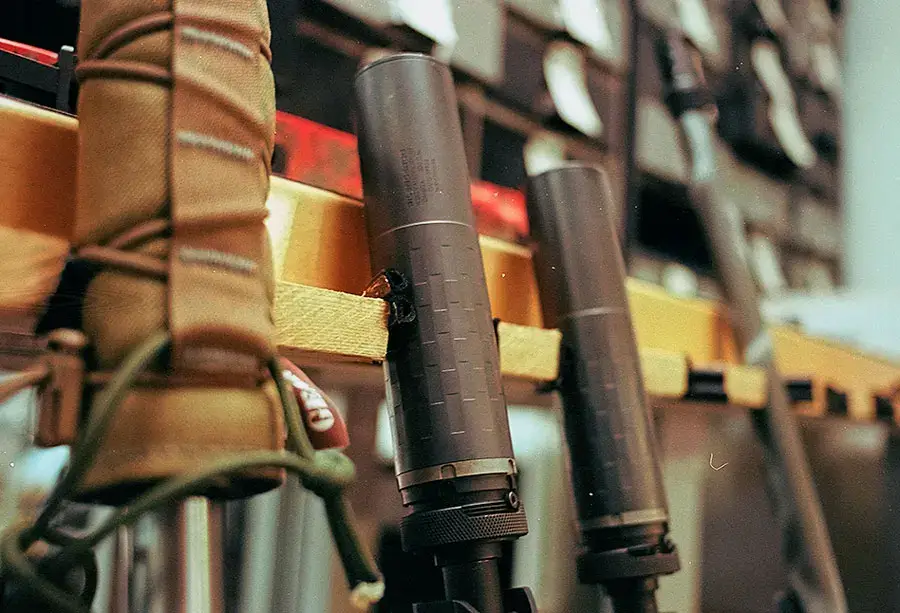 SilencerCo Omega 300 suppressors on a rack