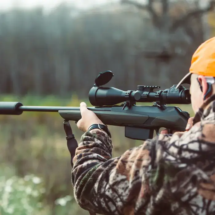 A hunter with a SilencerCo suppressor