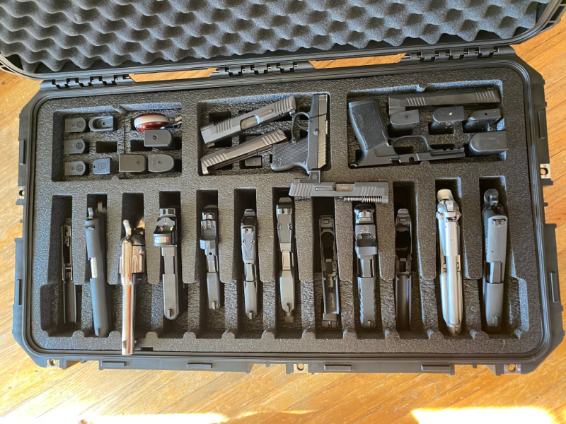 SKB gun case with 12 handguns, traveling with suppressors