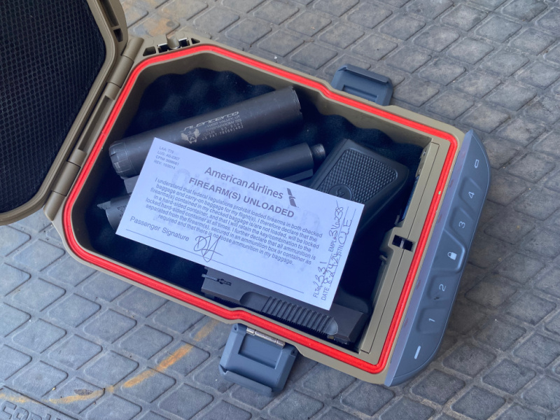 TSA approved gun case with unloaded handgun and SilencerCo suppressor - checked with document. Traveling with suppressors