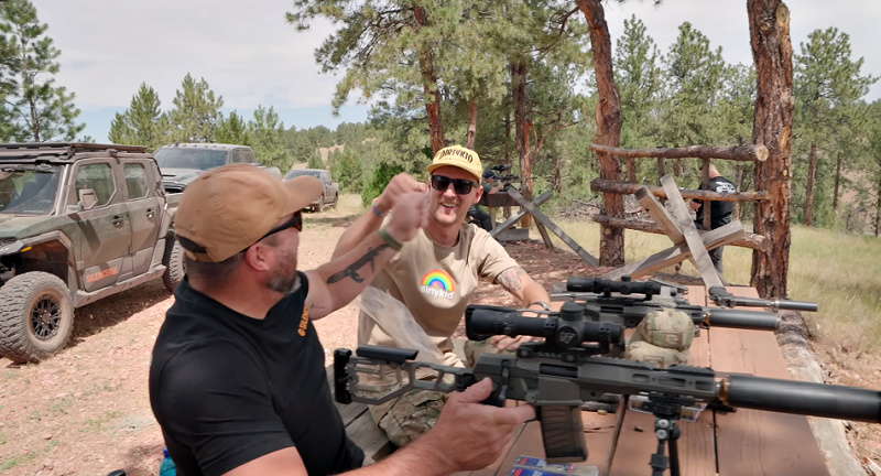 SilencerCo summer camp - double fist bump after both shooters hit steel target at 515 yards - double ding