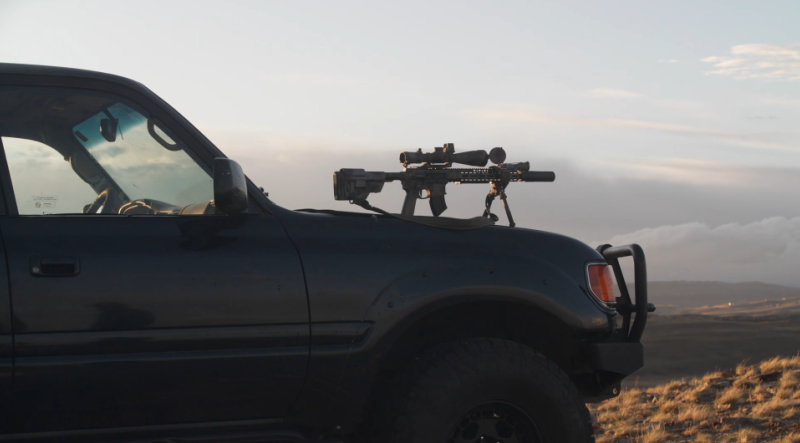 SilencerCo suppressed precision rifle on car