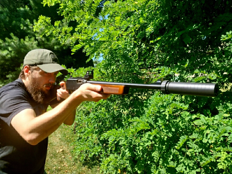 man shooting Homesteader carbine suppressed with Spectre 9.