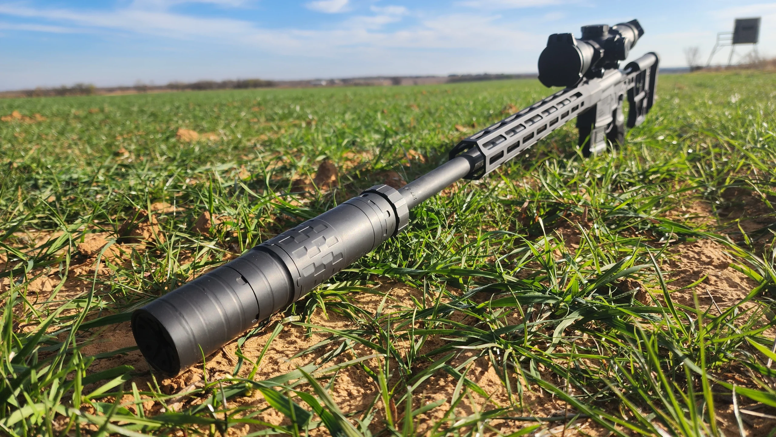 suppressor on SIG Cross in green field