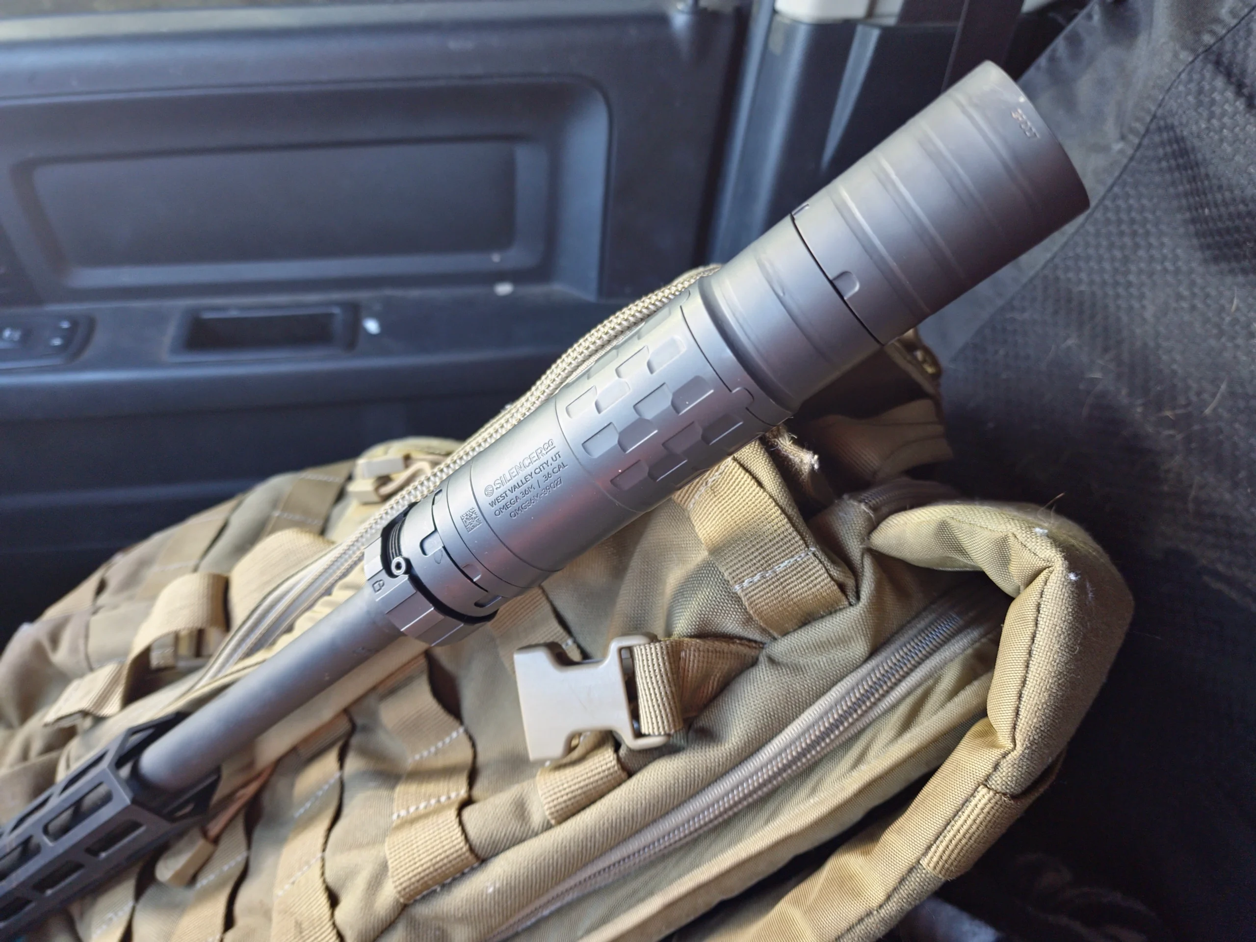 suppressor on a backpack inside vehicle