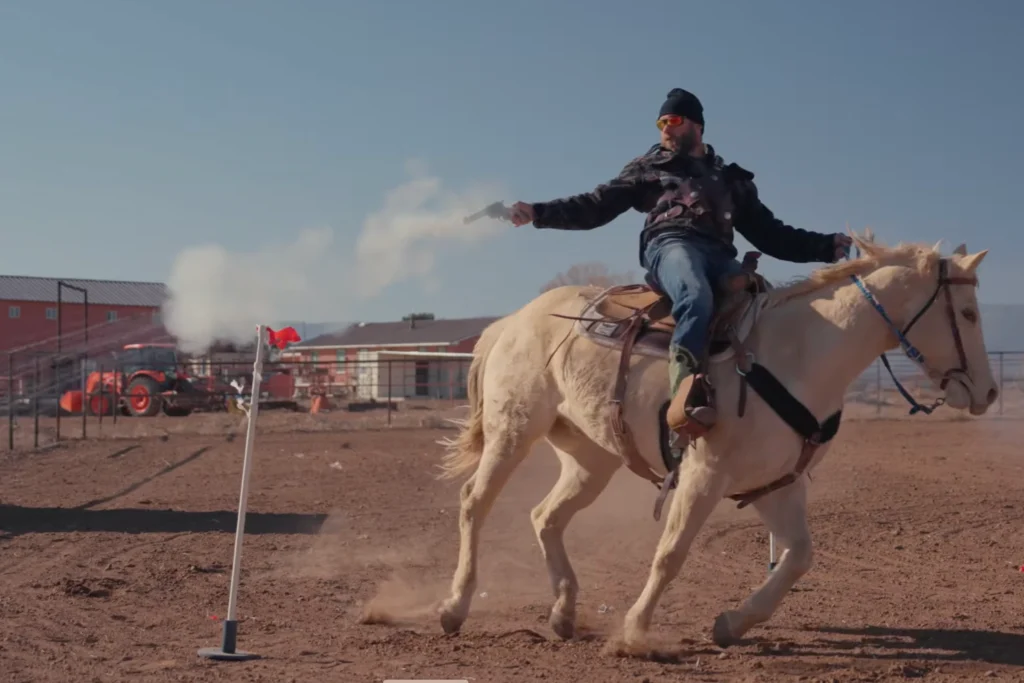 Cowboy Cerrone shooting balloons from horseback