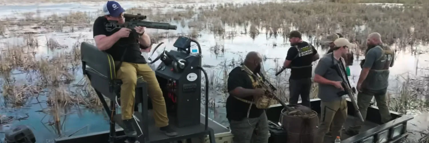 SilencerCo Crew with suppressed firearms, hunting nutria from a boat