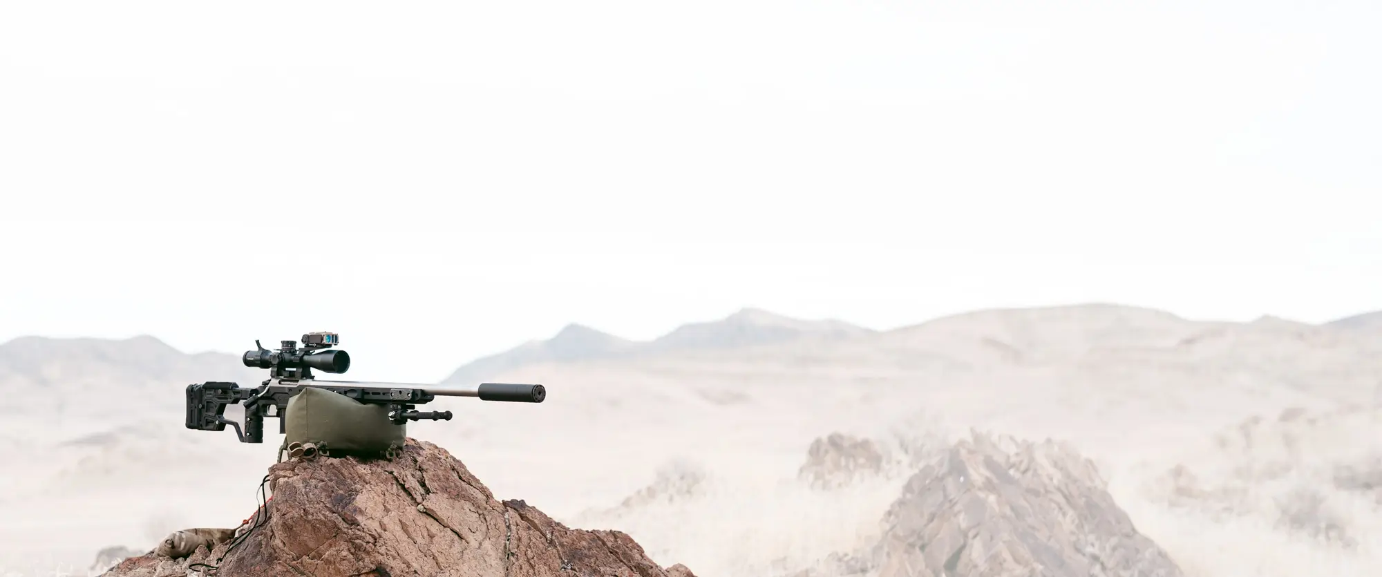 silencerco scythe-ti on a rifle, rocky mountains