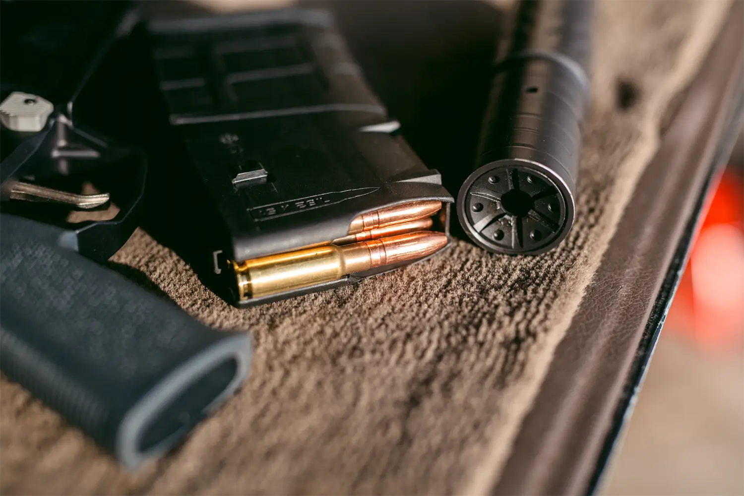 8.6 Blackout cartridges in a magazine, next to SilencerCo Omega 36m suppressor