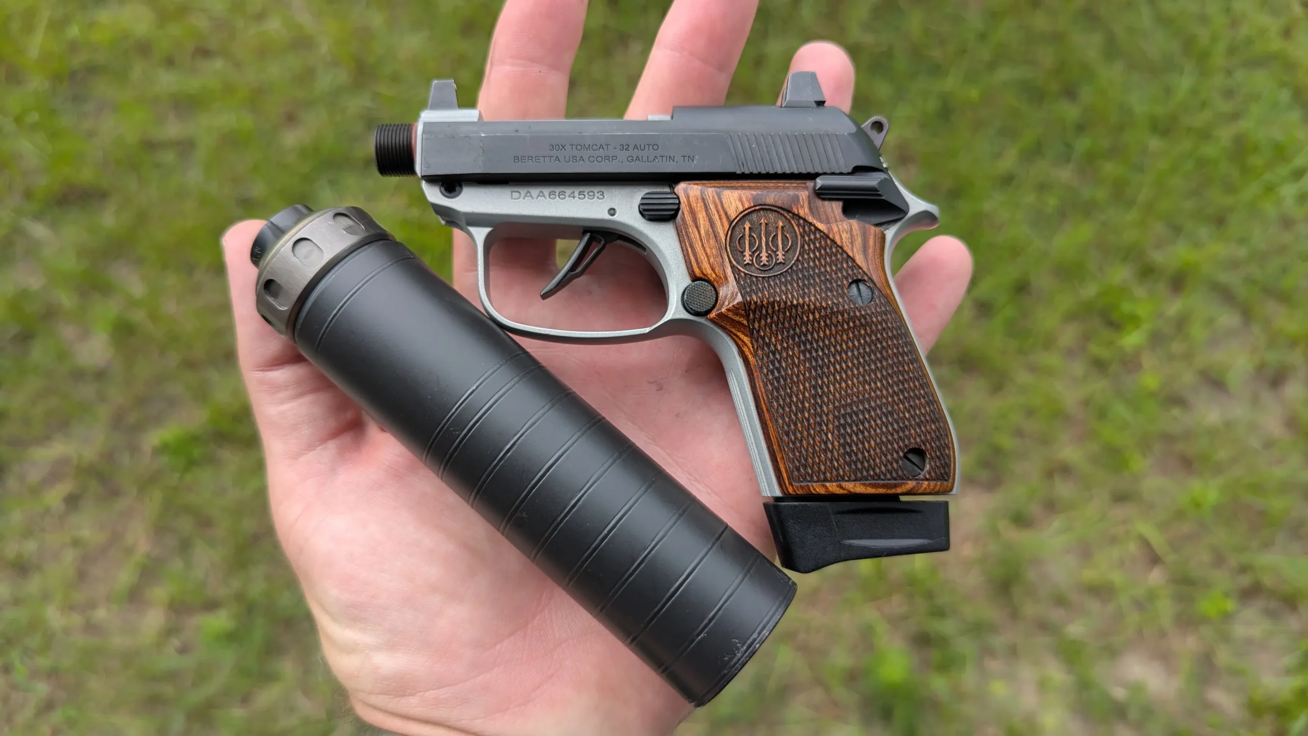 pocket pistol in hand with SilencerCo Spectre 9 suppressor