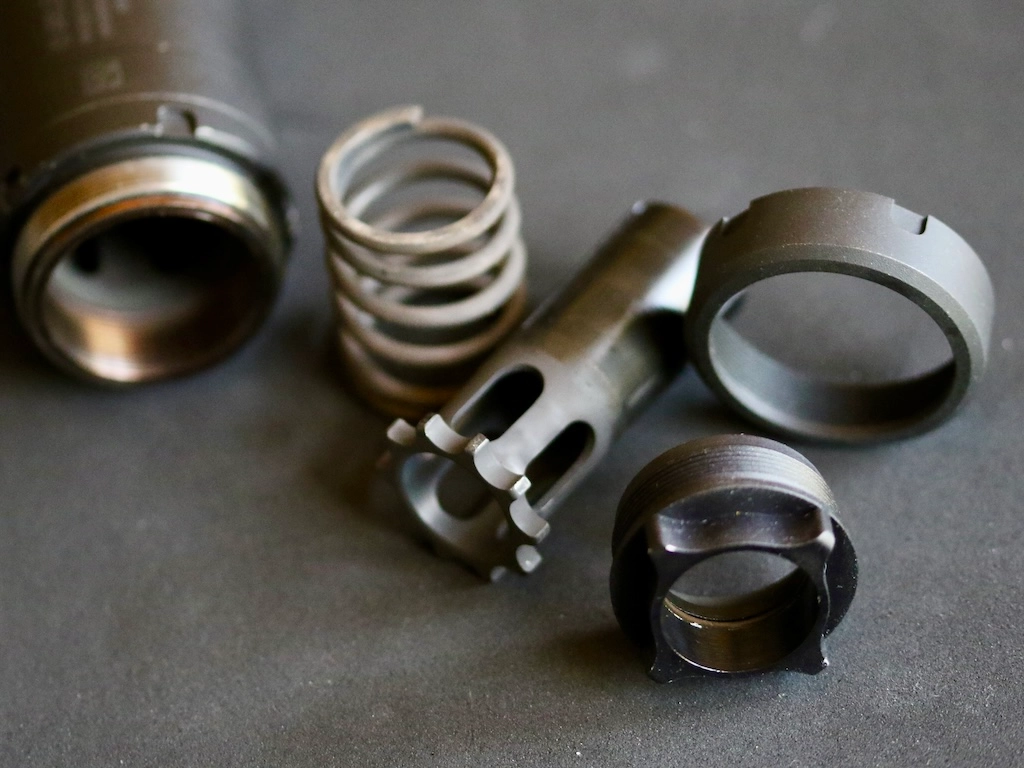 Nielsen device components - piston, spring, endcap, threaded barrel