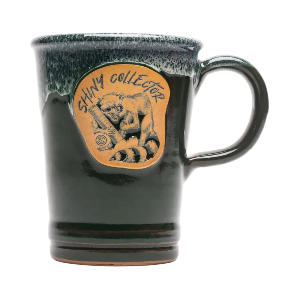 A Green SilencerCo Shiny Collector Deneen Pottery 16 Oz. Commuter Mug.