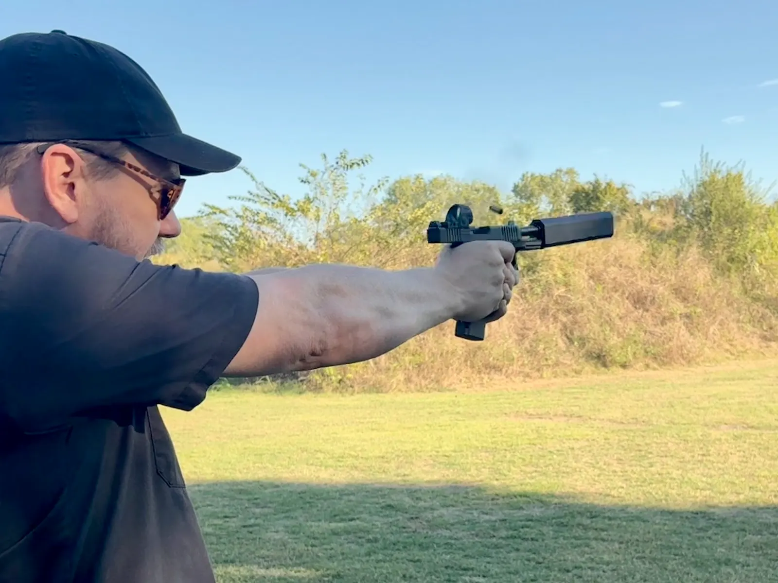 Man shooting suppressed Gen 6 G45 with 147-Grain 9mm Subsonic ammo with Osprey 2.0 at an outdoor range.