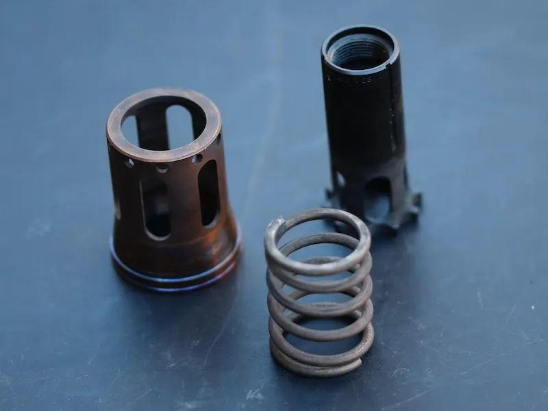 Nielsen device components: piston, spring, and housing