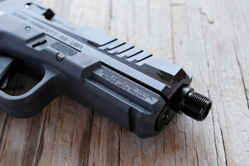 closeup of threaded barrel and angular front slide serrations on Ruger RXM