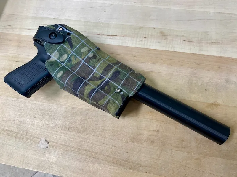 Safariland suppressor holster prototype with white grid lines to help determine Boltaron bends and stretches