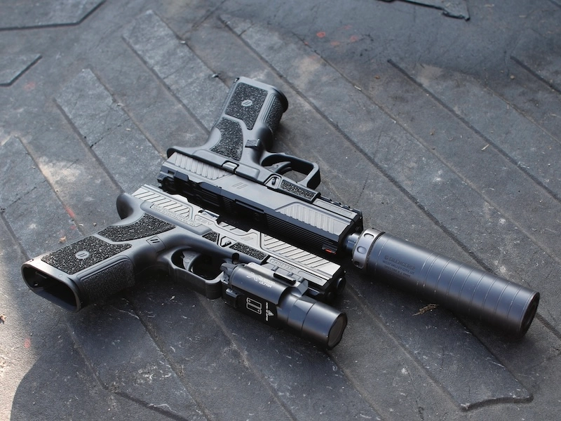 Two Zev OZ9s, one with a weaponlight and one with a suppressor