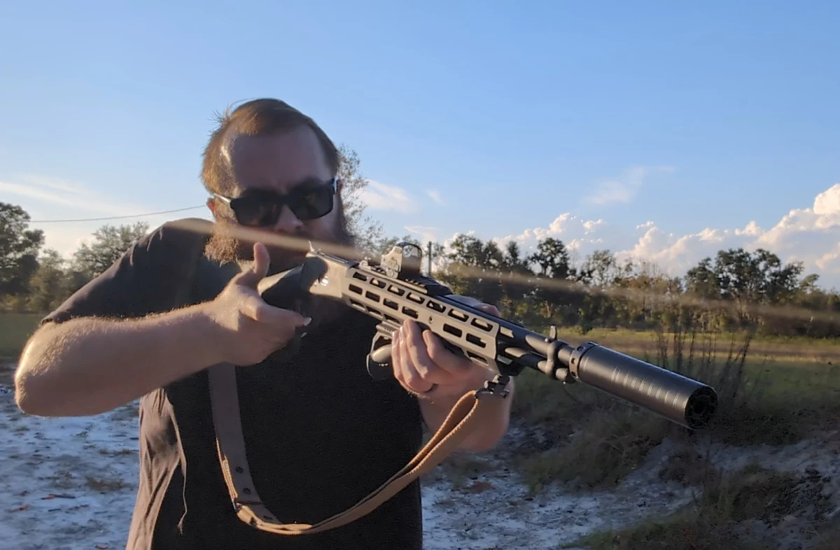 man working the action on a suppressed Citadel LevTac lever rifle