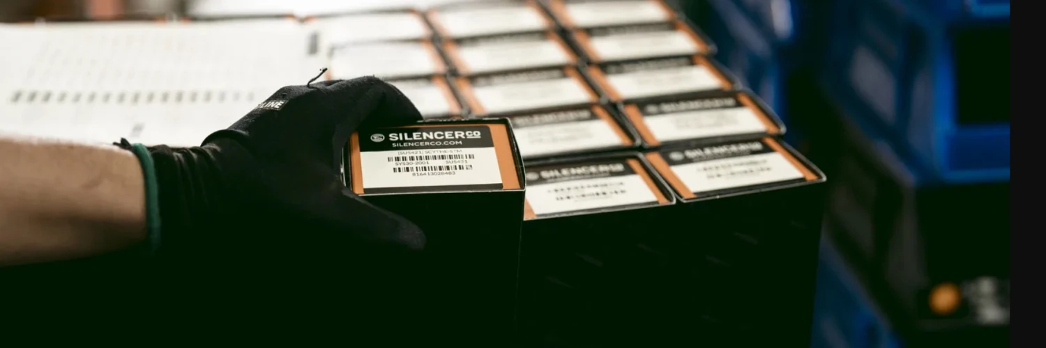packaged suppressors in boxes, shipping labels up
