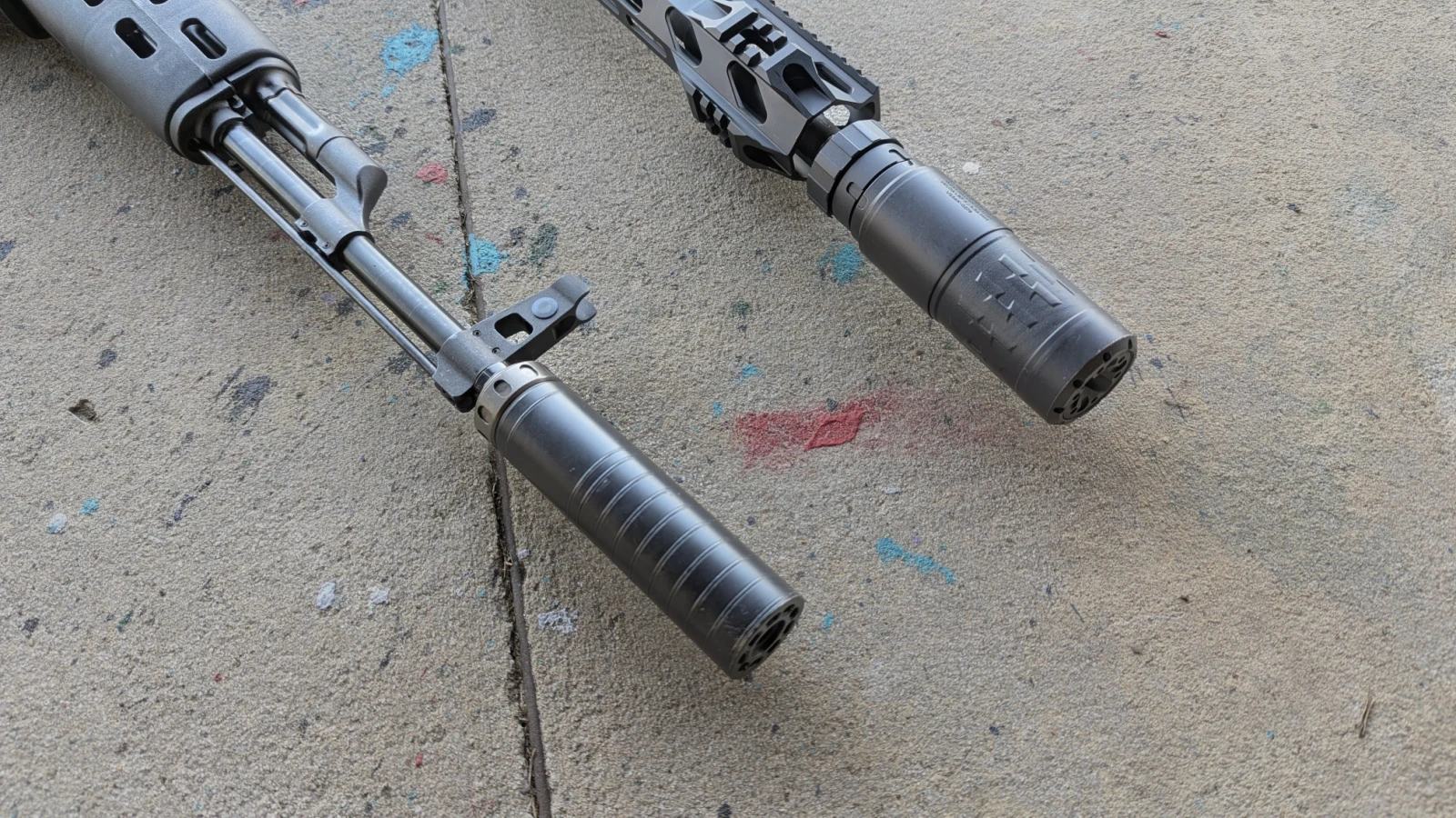 SilencerCo full-auto rated suppressors on the end of rifles - titanium and inconel durability assists with the increased rate of fire with FRTs, binary triggers, and super safeties.