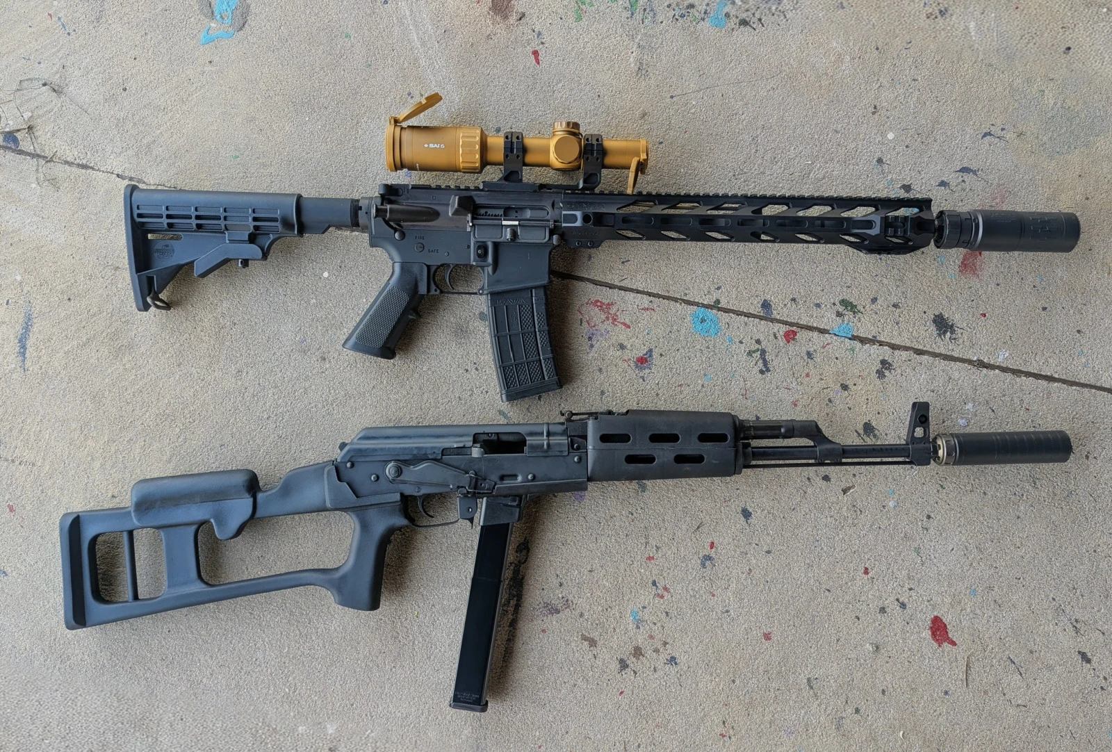 two rifles with two full auto rated suppressors
