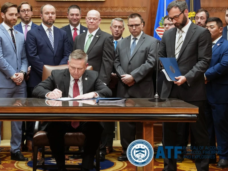 Robert Cekada signs 2026 ATF reform package at DOJ event.