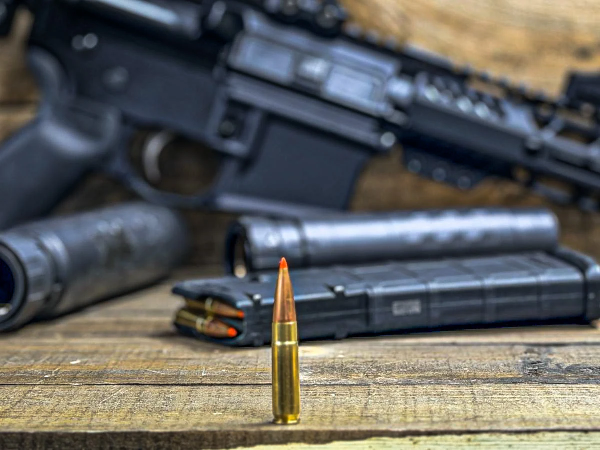 .300 Blackout cartridge with rifle magazine and silencerco suppressors