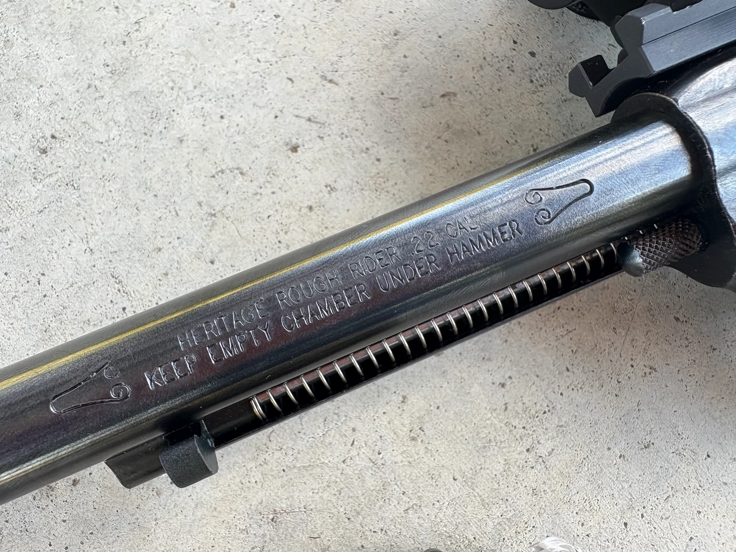 Barrel engraving that says Heritage Rough Rider .22 Cal Keep Empty Chamber Under Hammer.