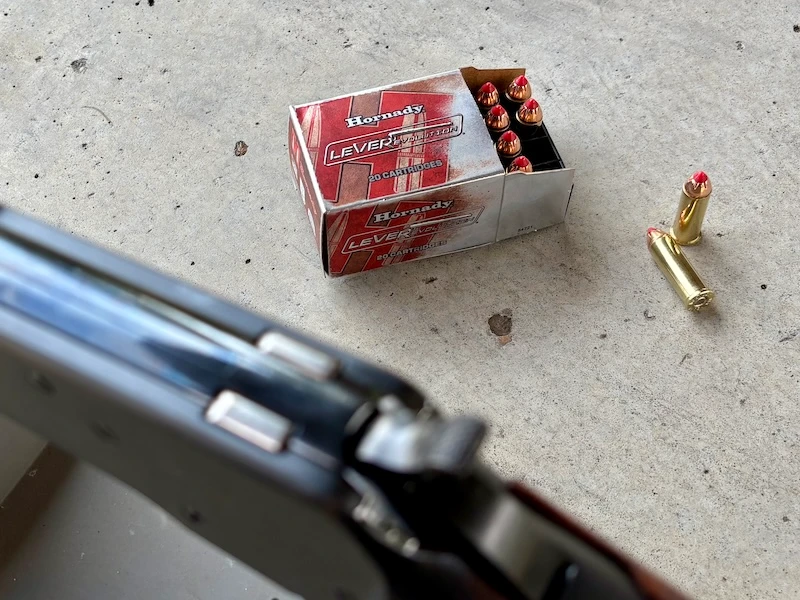 Box of Hornady .44 Magnum LEVERevolution ammunition with FTX polymer-tip bullets and lever action rifle in the foreground