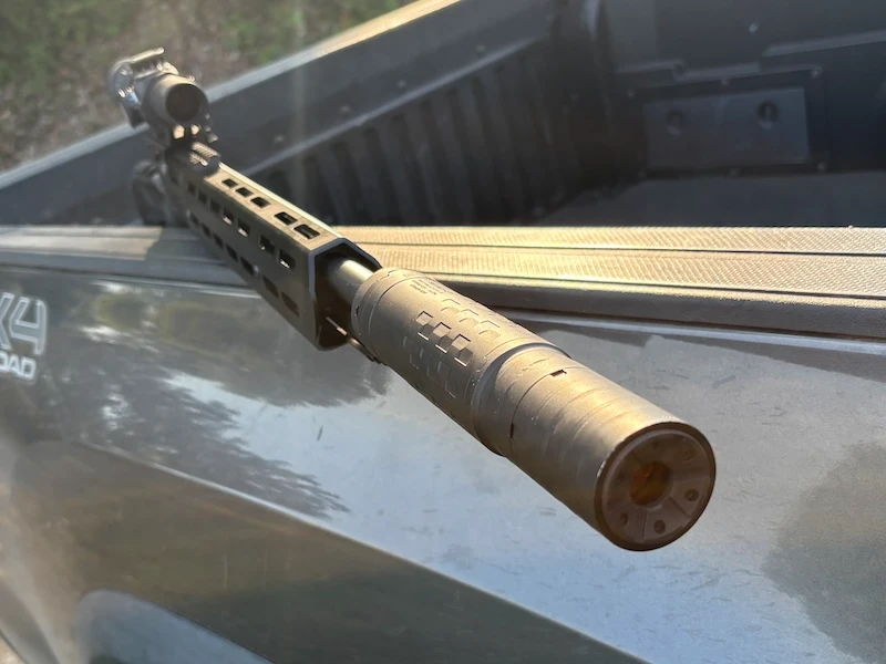 SilencerCo Hybrid 46M suppressor mounted on a .45-70 lever-action rifle